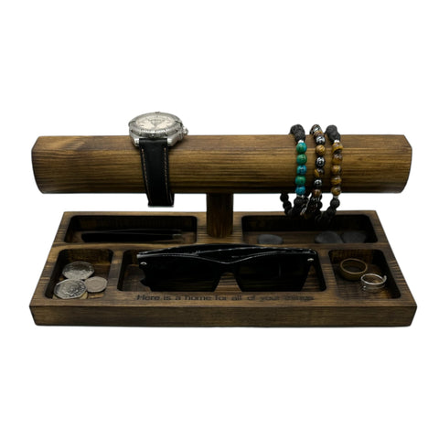 Wooden watch and bracelet display with jewellery on.