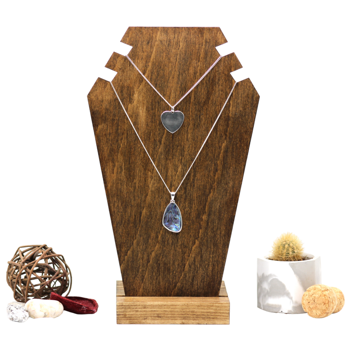 Plywood bust display with necklaces on 